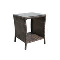 Wicker side table with glass top on a white background