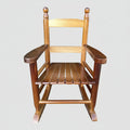 Classic children's solid oak rocking chair with a secure slatted backrest designed for indoor nurseries and outdoor patios.